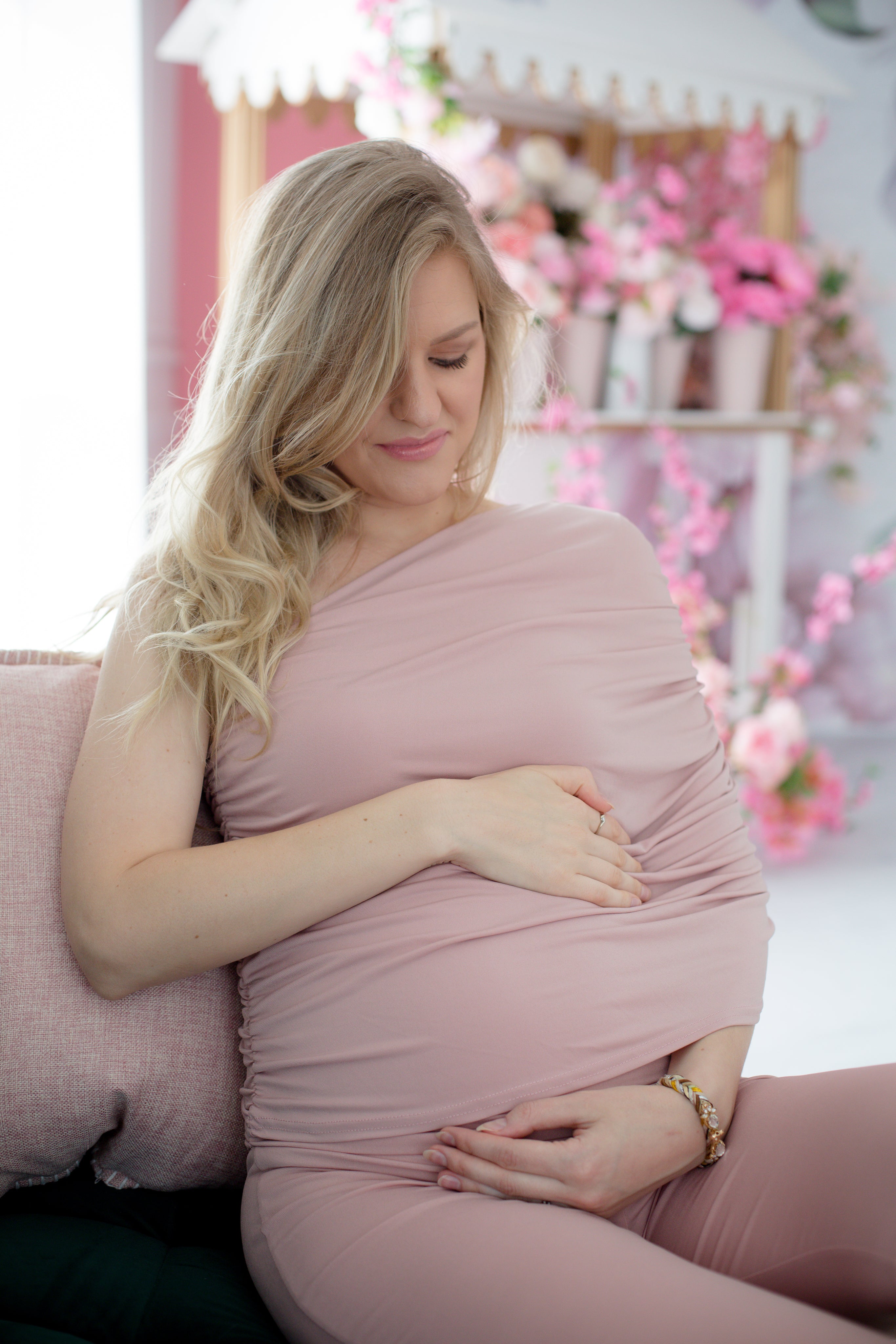 files/person-in-pink-looks-down-and-holds-there-belly.jpg